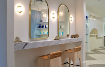Mirrors in the Kalos Hair Transplant, LLC hallway