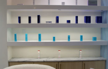 A display shelf with skincare products offered for sale at Kalos Hair Transplant, LLC in Atlanta GA.
