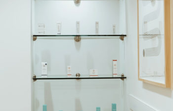 A display shelf with skincare products offered for sale at Kalos Hair Transplant, LLC in Atlanta GA.