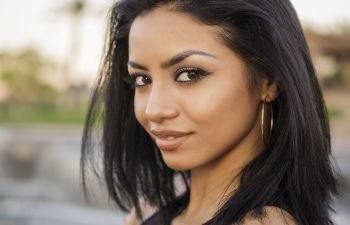 Beautiful Afro-American young woman with long straight hair.