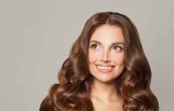 Beautiful brunette woman with long, thick wavy hair.