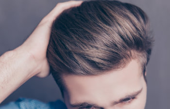 close up on thick and healthy hair man